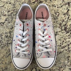New without box silver Converse with pink, blue and purple stars. Size 5.